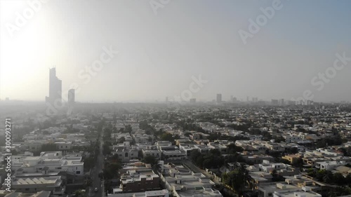Defence - Top Aerial View of the City of Karachi with skyscrapers view and beautiful skies - Moving  Up  photo