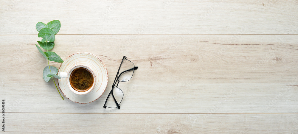 Cup of coffee on office desk. Top view. Free space for your text. Cup of coffee on office desk. Top view. Free space for your text.