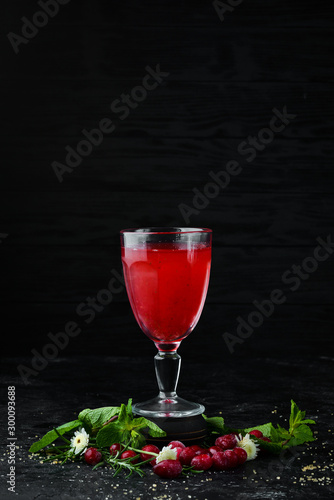 Fresh Morse of Cranberry Berries In a glass. Top view. On a black background.