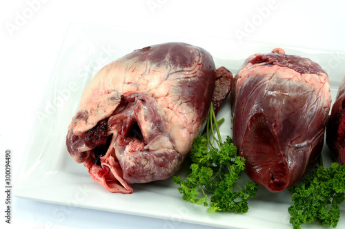 raw pork heart on a white background