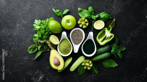 Healthy Green food Clean eating selection Protein source for vegetarians: avocado, lime, onion, apple, kiwi, spirulina. Top view. Free space for your text.