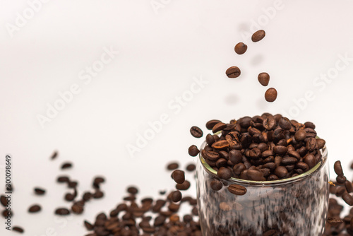Coffee beans in cup and all around. Background. Texture