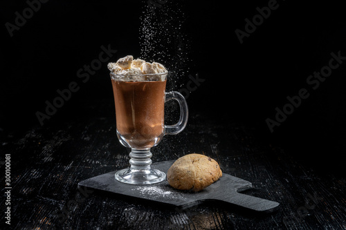 Chocolate dessert, hot chocolate with slices of ice cream, two livers lie nearby. photo