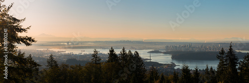 A sunrise view of downtown Vancouver, Stanley Park, and the Lions Gate Bridge as seen from Cypress Mountain. © Adam