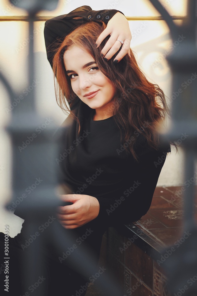 Young pretty girl walking down the street, retro portrait