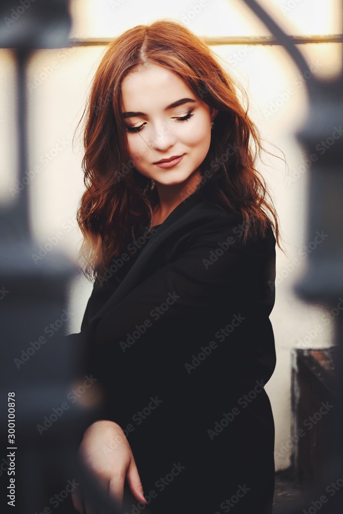 Young pretty girl walking down the street, retro portrait