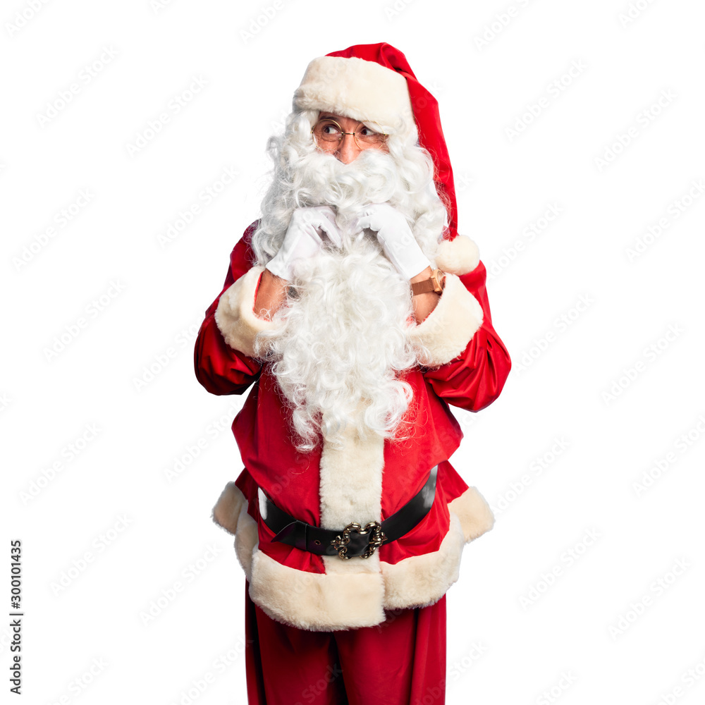 Middle age handsome man wearing Santa Claus costume and beard standing laughing nervous and excited with hands on chin looking to the side Middle age handsome man wearing Santa Claus costume and beard standing laughing nervous and excited with hands on chin looking to the side