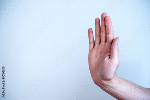 Defense or stop gesture: Male hand with stop gesture