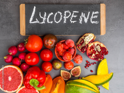 Fruits and vegetables containing lycopene. Healthy vegan food background. Lycopene is a red carotenoid pigment
