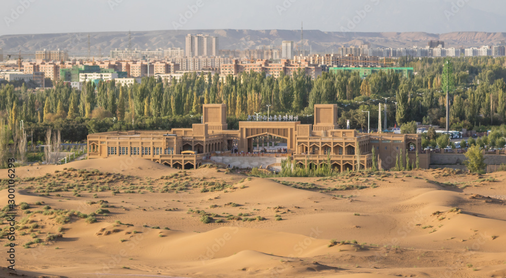 Fototapeta premium Shanshan, China - located right ad the border of the Kumtag Desert, Shanshan is a medium sized city often used as starting point for the desert excursions
