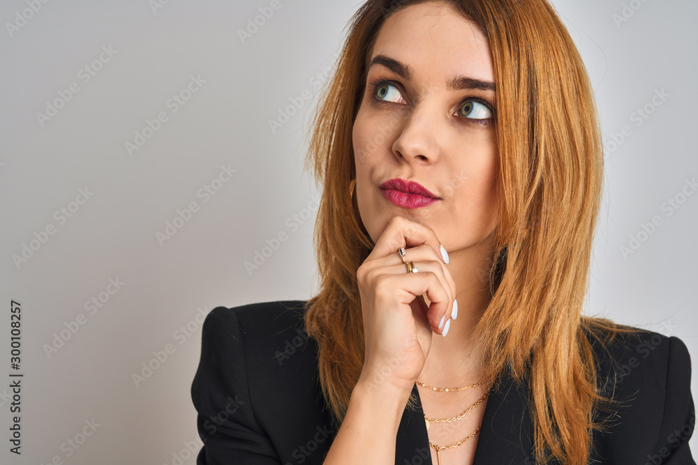 Close up of caucasian elegant business woman over isolated background serious face thinking about question, very confused idea Close up of caucasian elegant business woman over isolated background serious face thinking about question, very confused idea