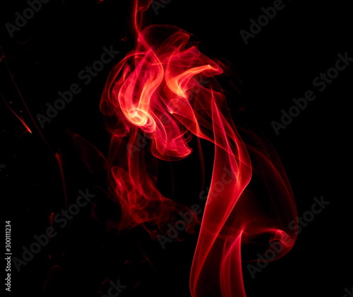 Red smoke on black background