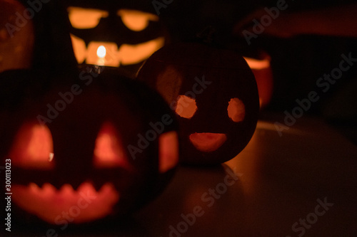 Group of the halloween, tasty pumpkins in the darkness during cold october night in Poland, Wroclaw