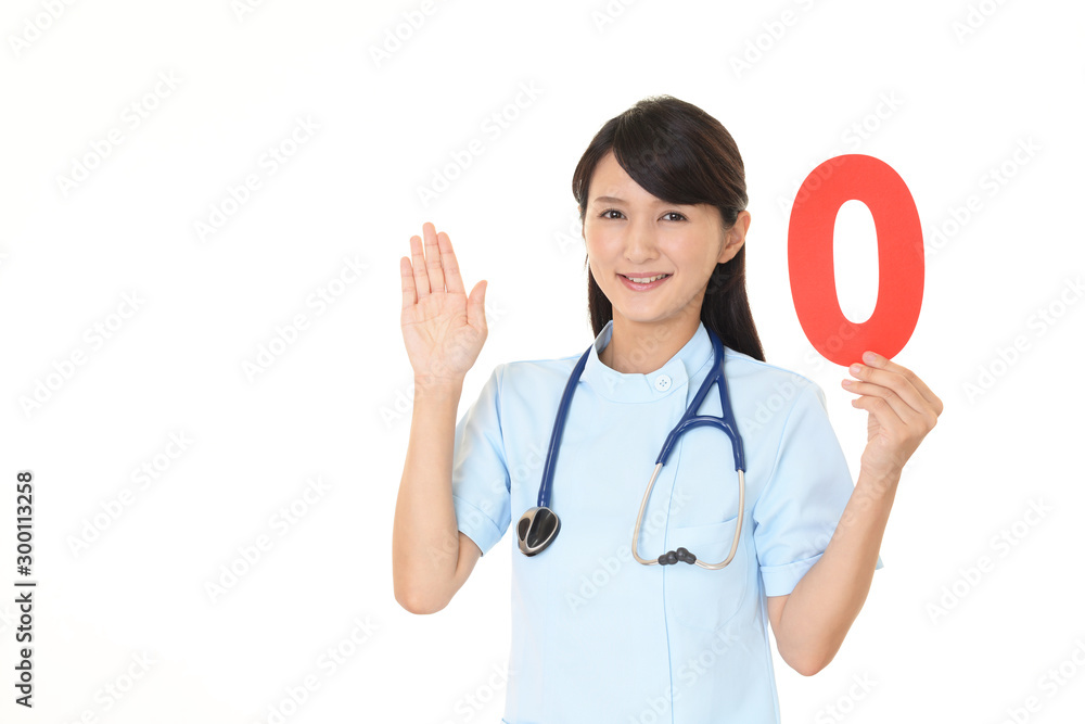 数字ゼロを持ち案内する看護士 数字ゼロを持ち案内する看護士