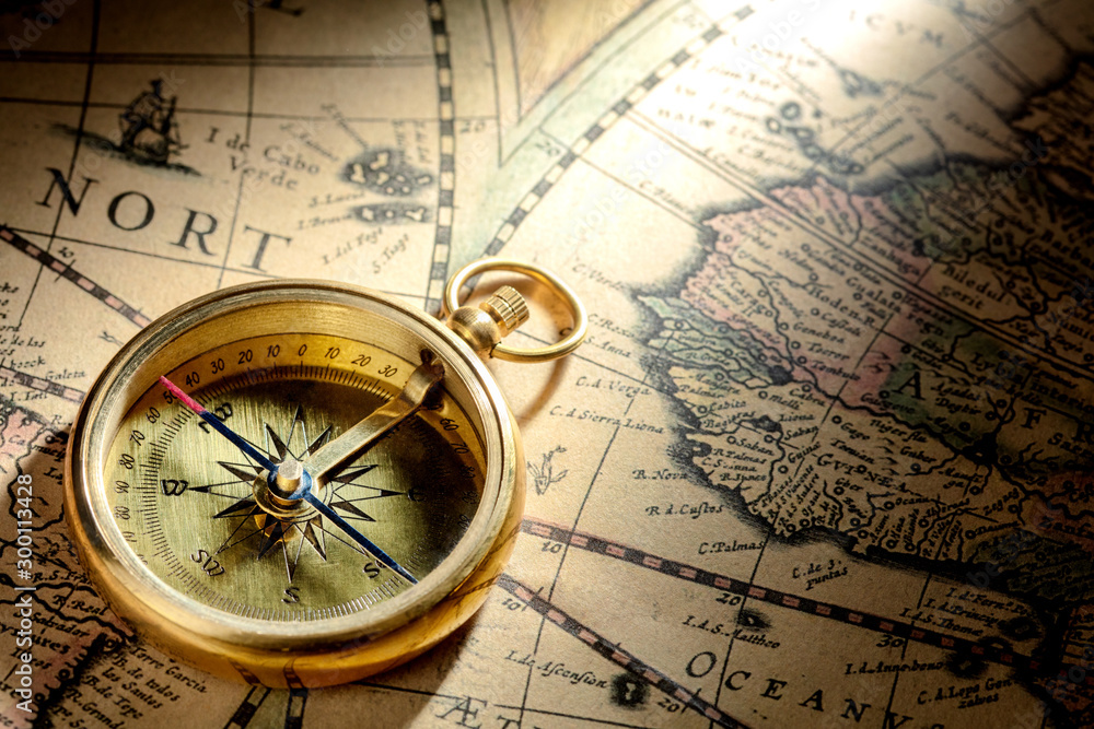 antique compass on ancient map dated 1652AD antique compass on ancient map dated 1652AD