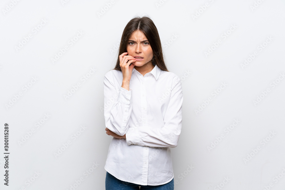Young woman over isolated white background nervous and scared Young woman over isolated white background nervous and scared