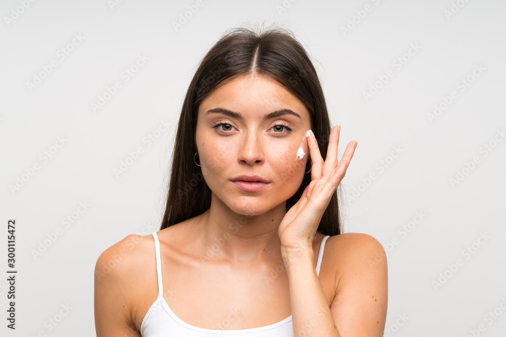 Pretty young woman with moisturizer Pretty young woman with moisturizer