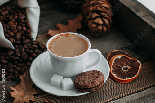 coffee Cup with beans on wooden background