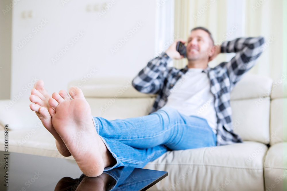 Fototapeta premium Blurred background of young man speaks on a phone