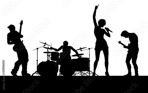 A musical group or rock band playing a concert in silhouette