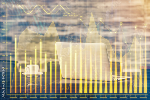 Financial chart drawing and table with computer on background. Multi exposure. Concept of international markets. © peshkova