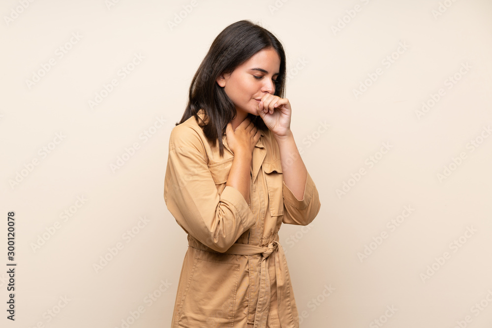 Young girl over isolated background is suffering with cough and feeling bad Young girl over isolated background is suffering with cough and feeling bad