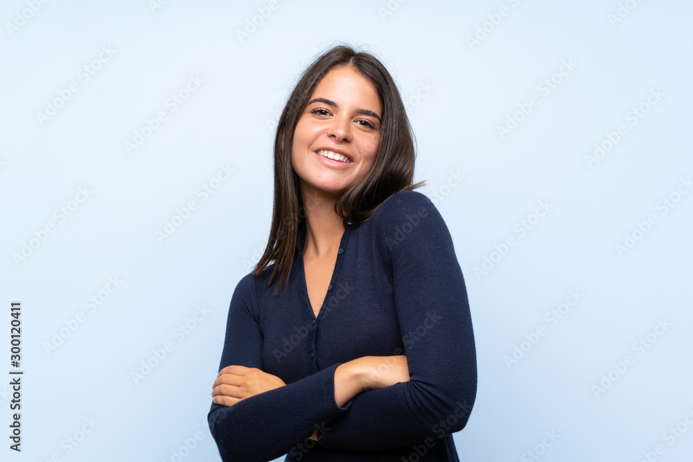 Young girl over isolated blue background laughing Young girl over isolated blue background laughing