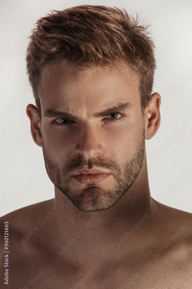 Handsome sport sexy stripped guy portrait with white underwear on isolated white background and shadows Handsome sport sexy stripped guy portrait with white underwear on isolated white background and shadows