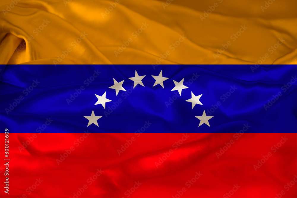 photo of the beautiful colored national flag of the modern state of Venezuela on textured fabric, concept of tourism, emigration, economics and politics, closeup photo of the beautiful colored national flag of the modern state of Venezuela on textured fabric, concept of tourism, emigration, economics and politics, closeup