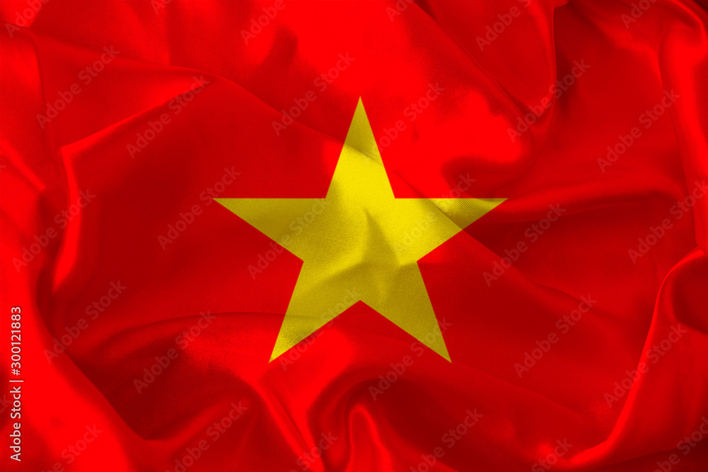 beautiful photo of the colored national flag of the modern state of Vietnam on a textured fabric, concept of tourism, emigration, economy and politics, closeup beautiful photo of the colored national flag of the modern state of Vietnam on a textured fabric, concept of tourism, emigration, economy and politics, closeup