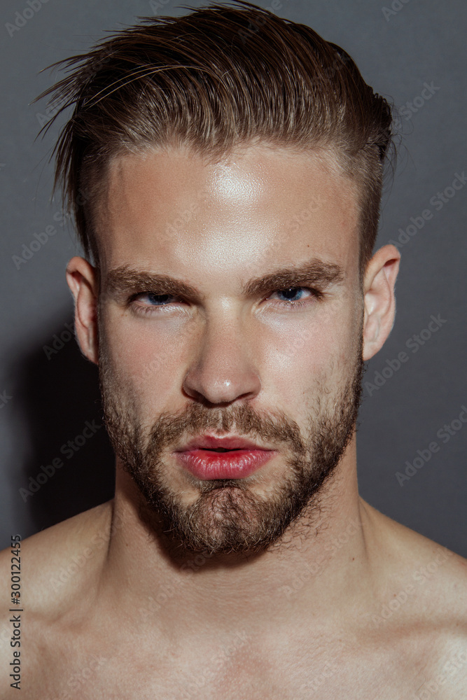Handsome sport sexy stripped guy portrait for cosmetics on isolated gray background with fields Handsome sport sexy stripped guy portrait for cosmetics on isolated gray background with fields