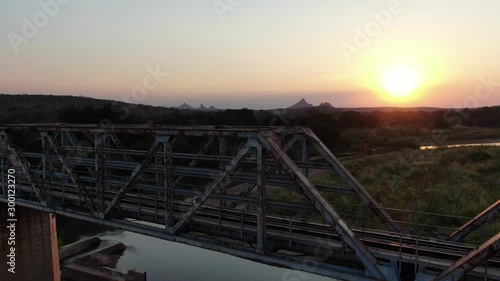 Aerial View of Gorgeous Sunset Over Olifants River and Railway Bridge, Kruger National Park, South Africa photo