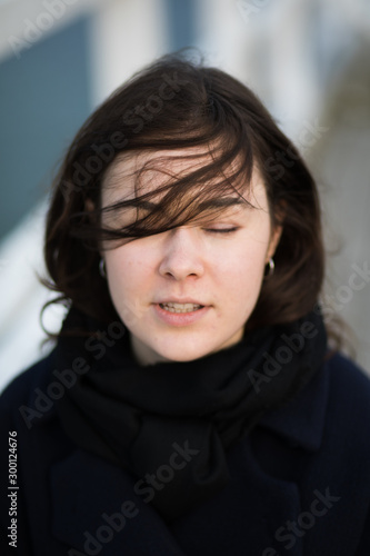 Portrait of young woman walking on pier © Jacek Chabraszewski