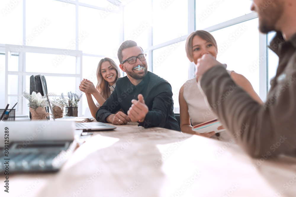 Fototapeta premium business team discussing documents sitting at the table
