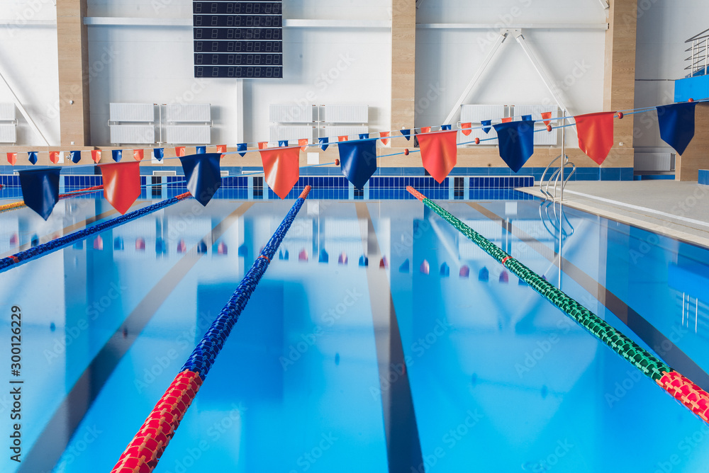 Naklejka premium Swimming pool without people. Sunny day at the pool