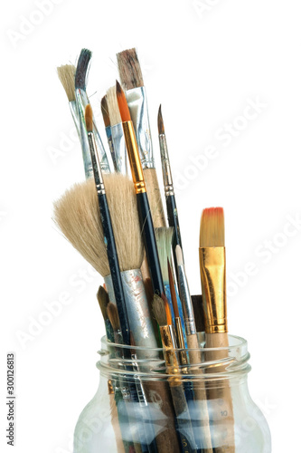 Various professional paint brushes in the jar