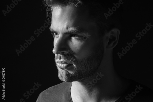 Black and White Muscle strong beautiful stripped male model in casual cloath on black isolated font background