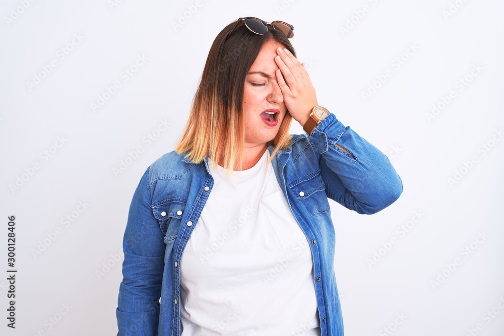 Beautiful woman wearing denim shirt standing over isolated white background Yawning tired covering half face, eye and mouth with hand. Face hurts in pain. Beautiful woman wearing denim shirt standing over isolated white background Yawning tired covering half face, eye and mouth with hand. Face hurts in pain.