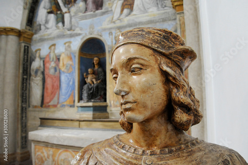 Bust of Raffaello Sanzio, known as Raphael. On the background there is a fresco painted by Raffaello Sanzio. Chapel of San Severo, Perugia, Italy photo