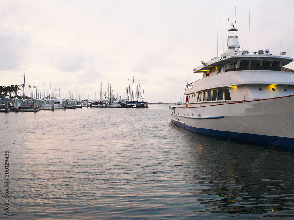 Naklejka premium White yacht docked in the Marina