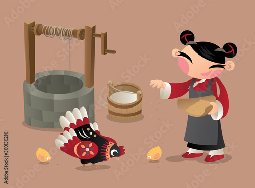 A Chinese village woman feeding chicken