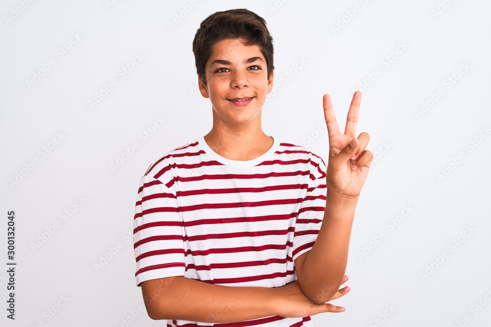 Handsome teenager boy standing over white isolated background smiling with happy face winking at the camera doing victory sign. Number two. Handsome teenager boy standing over white isolated background smiling with happy face winking at the camera doing victory sign. Number two.