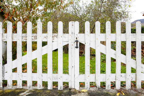 White fence with wooden fence