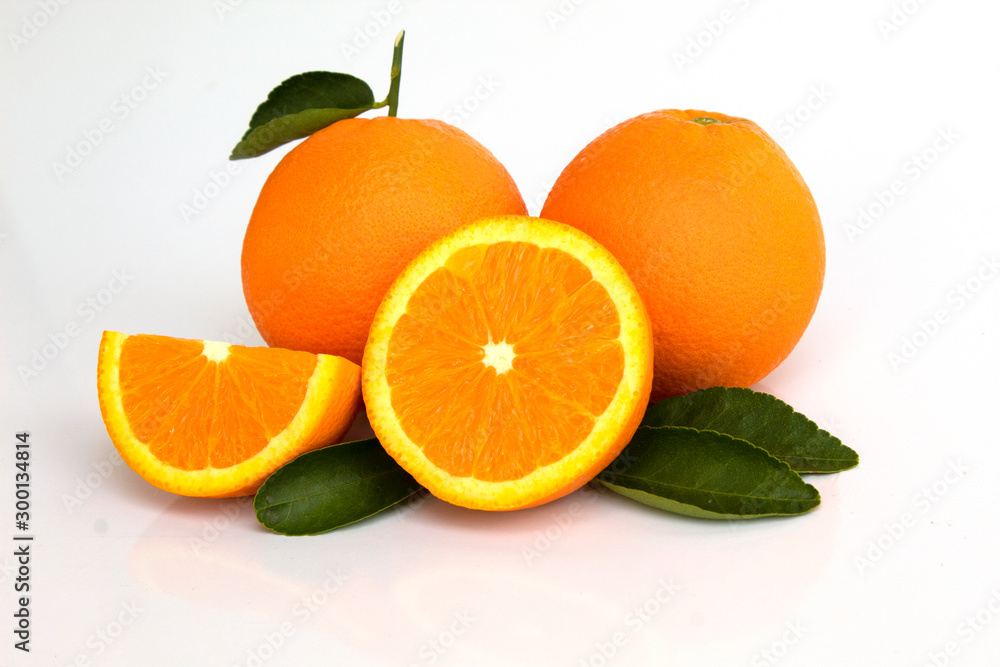 oranges with leaves isolated on white background