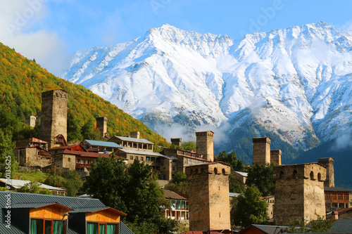 Stunning View of Medieval Svan Tower-houses against the Snow-capped Caucasus Mountain in Mestia, Svaneti Region of Georgia photo