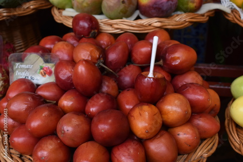 Closeup of tomatoe passion fruits on a local market in Funchal in Madeira, Portugal
