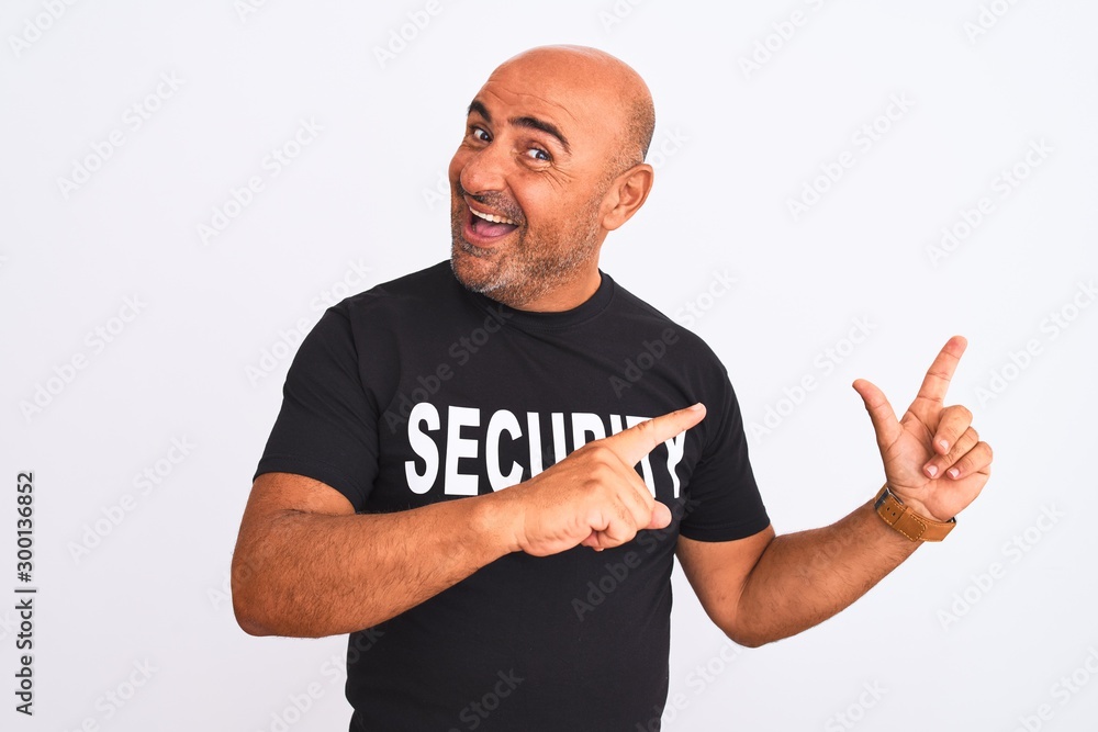 Middle age safeguard man wearing security uniform standing over isolated white background smiling and looking at the camera pointing with two hands and fingers to the side. Middle age safeguard man wearing security uniform standing over isolated white background smiling and looking at the camera pointing with two hands and fingers to the side.