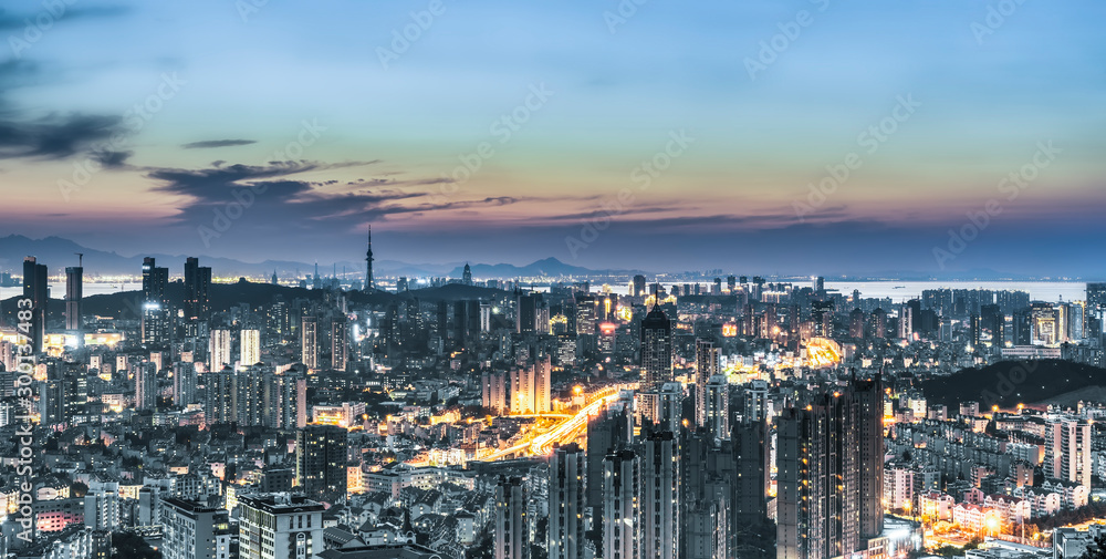 Night view of Qingdao coastline architecture and urban skyline..