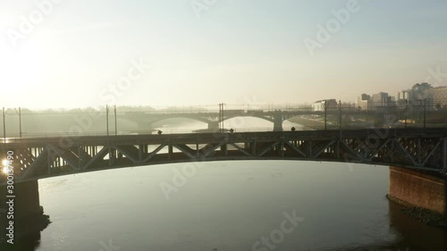 Wallpaper Mural Aerial view of a beautiful sunrise and a river with bridges and a stadium. Cityscape with river and bridges in the morning in the fog. Warsaw. Poland. Torontodigital.ca