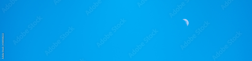 blue sky with moon using as background cover page concept. blue sky with moon using as background cover page concept.